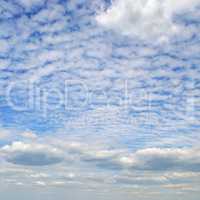 light cumulus clouds in blue sky