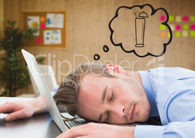 Business man asleep at laptop dreaming of cocktail against blurry office