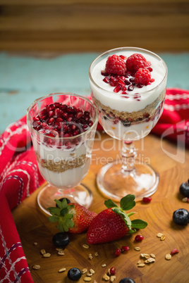 Cup of cereals with fruits and yogurt