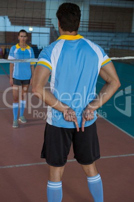 Rear view of volleyball player gesturing while playing