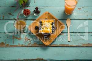 Breakfast tray with glass of juice and tea