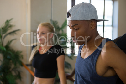 Thoughtful male dancer with friend