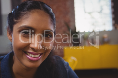 Portrait of smiling woman in cafe