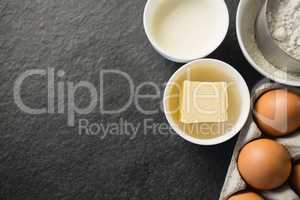 Overhead view of butter in bowl by ingredients