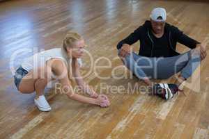 Full length of dancers practicing on floor