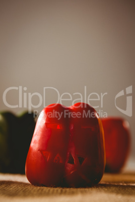 Carved red bell pepper on sack