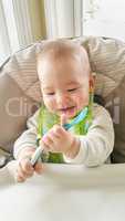 Adorable Chinese and Caucasian Baby Boy Playing With His Spoon S