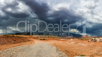 Ominous Stormy Sky and Cumulus Clouds with Rain in the Desert