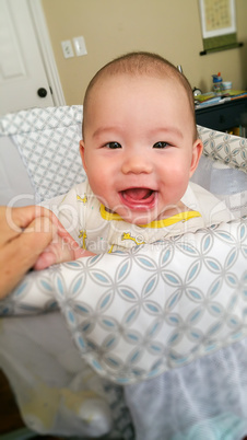 Adorable Chinese and Caucasian Baby Boy Playing In His Crib.