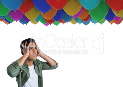 Man worried and anxious under many balloons