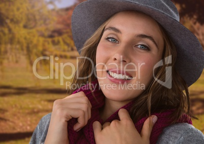 Woman in Autumn with hat and scarf in nature park