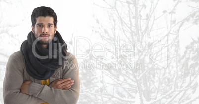 Man wearing scarf with arms folded in  bright snow forest