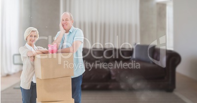 people moving boxes into new home