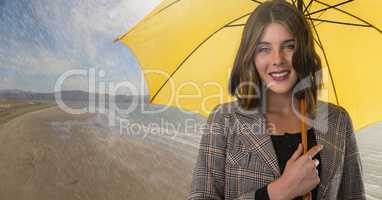 Woman with umbrella over beach