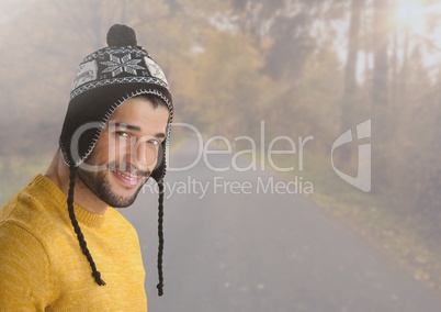 Man in Autumn with hat in forest
