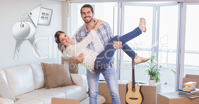 people moving boxes into new home with key