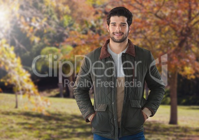 Man in Autumn with coat in forest