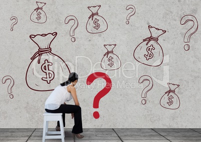 woman sitting in front of money on wall