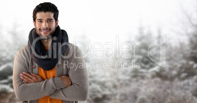 Man with scarf in snow forest