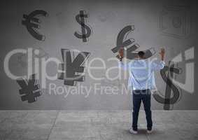 man in front of money on wall with arms up