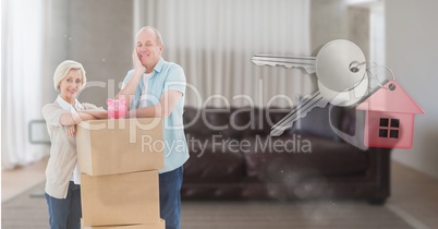 people moving boxes into new home with key