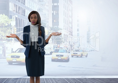 Businesswoman with arms open confused and questioning in city
