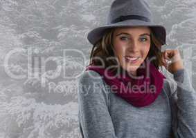 Woman in hat and scarf in snow forest