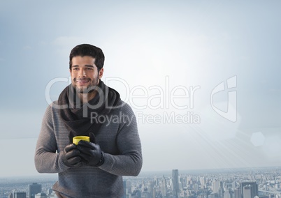 Man with cup over city