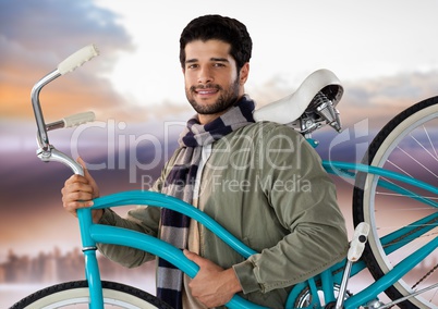 man holding bicycle with purple sky