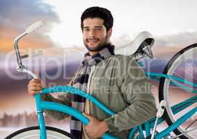 man holding bicycle with purple sky