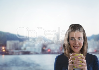 Woman holding cup with cold city