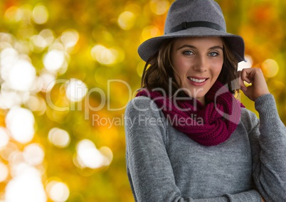 Woman in Autumn with hat and scarf in forest