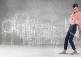 Businesswoman pushing against wall with city drawings