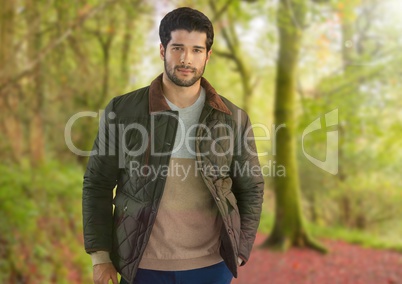 Man in Autumn with coat in forest