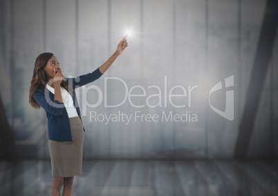 Businesswoman pointing by windows Businesswoman pointing by windows