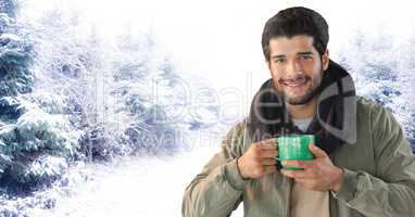 Man with scarf and cup in snow forest