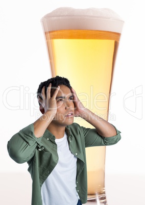 Man stressed and anxious with pint of beer