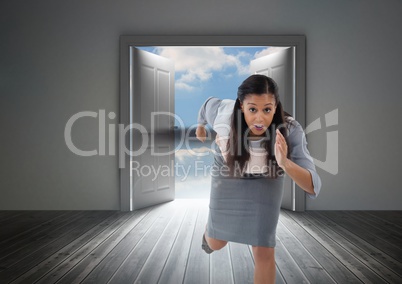 Businesswoman running in door from outside