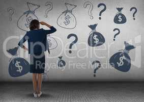 businesswomman in front of money on wall