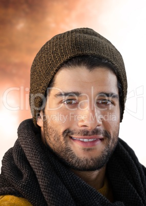 Man in Autumn with hat in bright light of forest