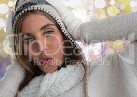 Woman in hat and scarf with sparkling light