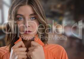 Woman holding jumper tight and blurred background