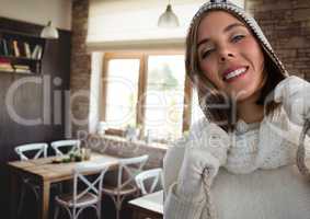 Woman in warm hat and gloves in cafe