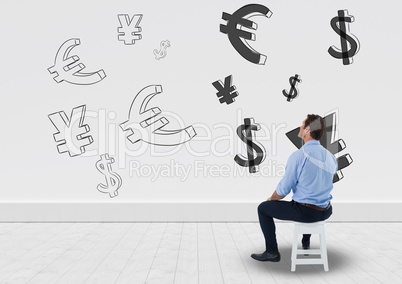 man sitting in front of money on wall