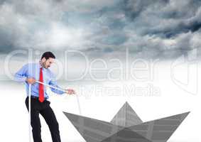 Businessman pulling paper boat with rope in sky