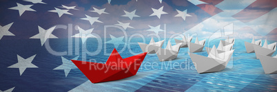 Composite image of red and white paper boats arranged