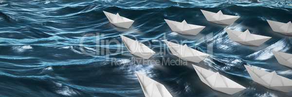 Composite image of high angle view of paper boats arranged