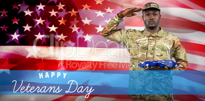 Composite image of portrait of soldier holding an american flag while Composite image of portrait of soldier holding an american flag while