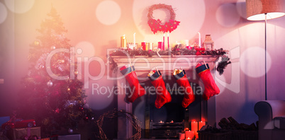 Christmas tree with presents near the fireplace