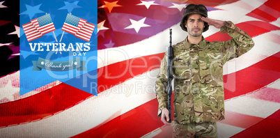 Composite image of portrait of soldier with rifle saluting
